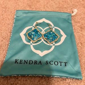 Beautiful Kendra Scott Turquoise earrings surrounded by champagne colored edging